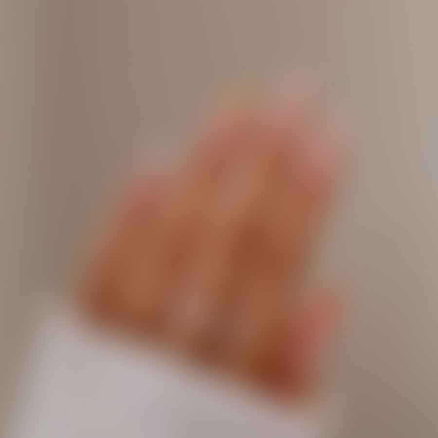 Close-up of short almond nails without any nail art