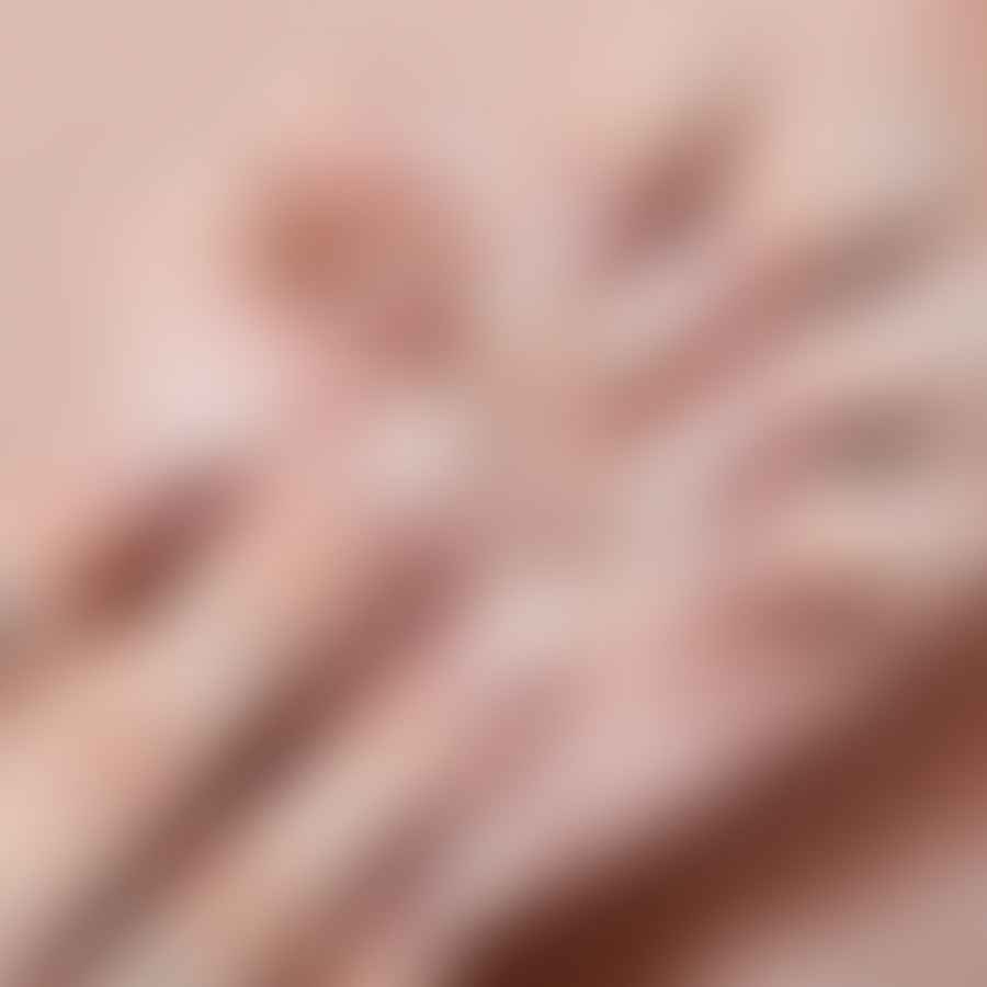 White nail polish and manicure tools for creating almond nails at home