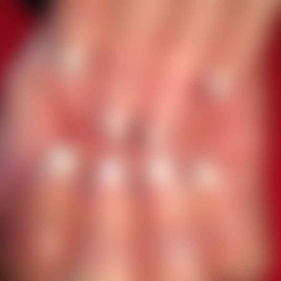 Close-up view of elegant white French tip almond nails