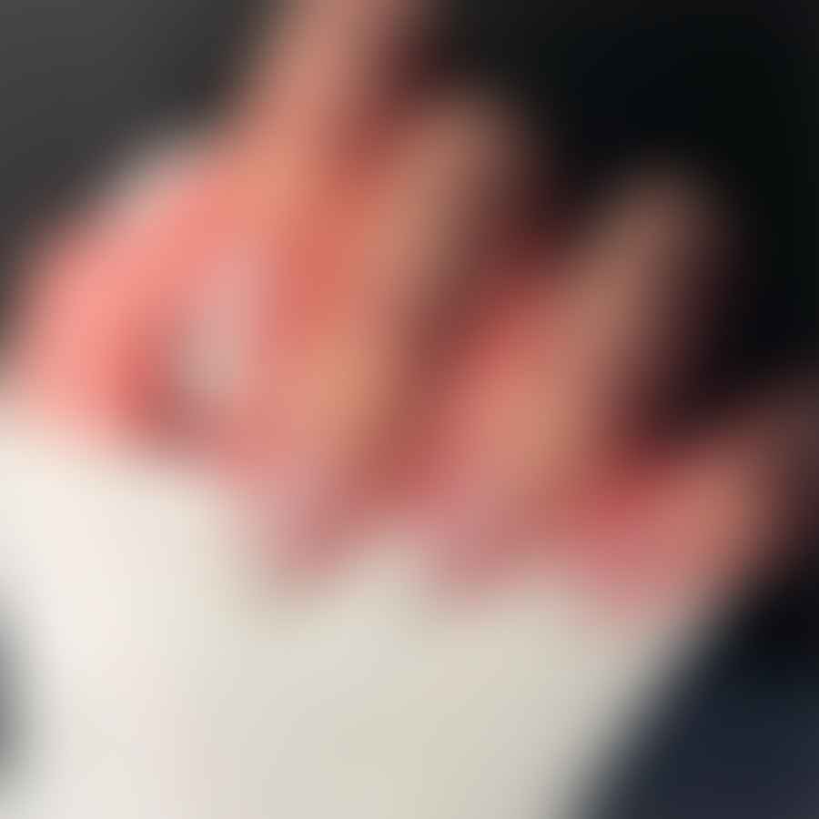 Elegant hand showcasing white almond-shaped nails