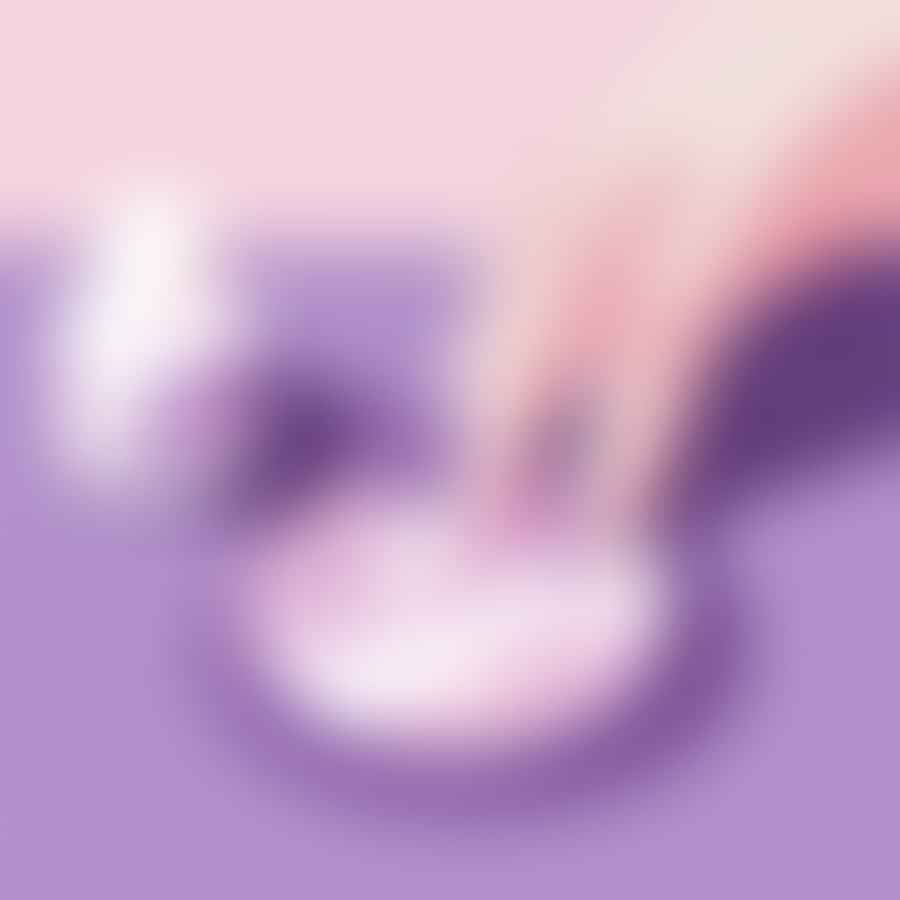 Applying top coat on painted nails